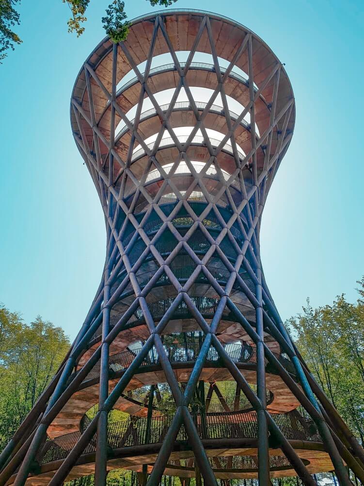 a uniquely shaped observation tower called The Treetop Experience in the beech forest of South Zealand, Denmark