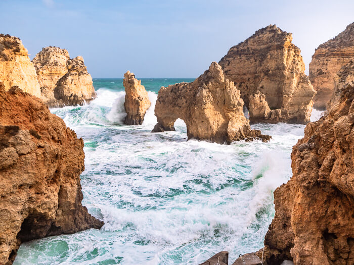 A picturesque cove full of rock formations and grottoes at Ponta da Piedade, a must-visit spot if you have 5 days in Algarve