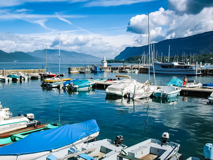 A harbor full of small boats at Lac du Bourget, one of the largest lakes in France