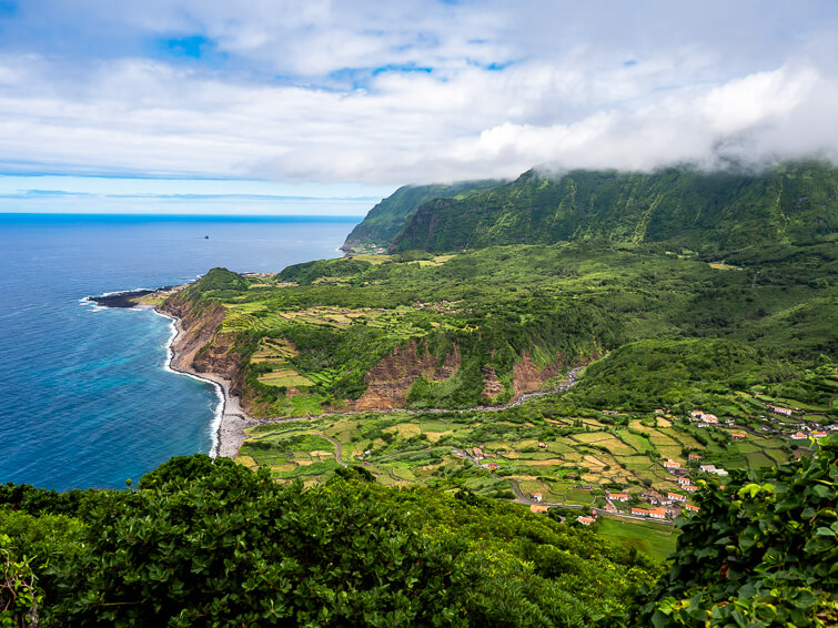 A panoramic view of the verdant green mountains and pastures on west coast of Flores Island.